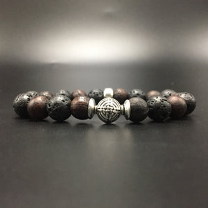 sterling silver center bead with volcanic lava and fossilize stone.